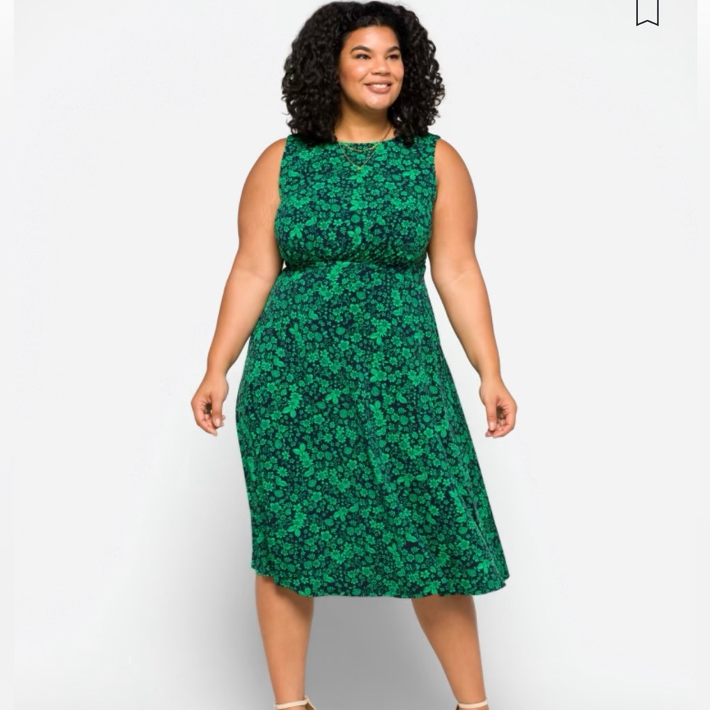 Green dress, calf length.